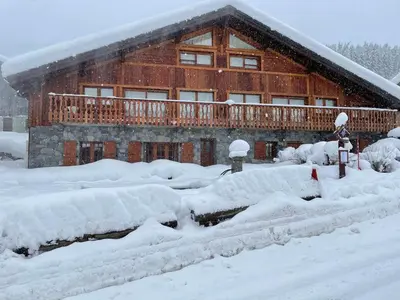 a house covered in snow in front at Ferme rénovée 4 ch, 3 sdb, PARKING, WIFI, proche pistes et commerces - FR-1-572-25 in Arâches-la-Frasse
