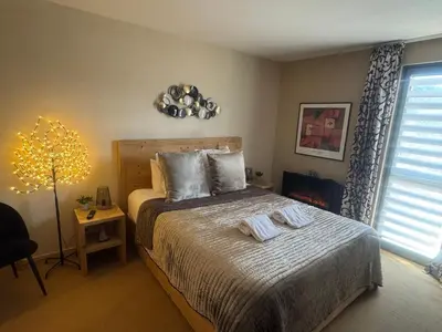 a bedroom with a bed with two towels on it at Belle Vue de St Gervais in Saint-Gervais-les-Bains