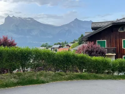 a house with a mountain in the background at Belle Vue de St Gervais in Saint-Gervais-les-Bains