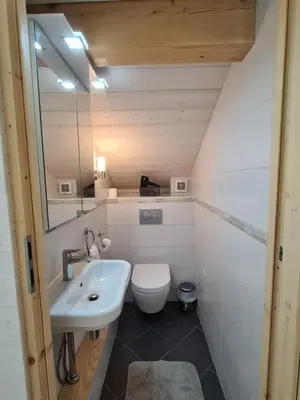 a small bathroom with a sink and a toilet at Chalet Cristal Trail in Chamonix-Mont-Blanc