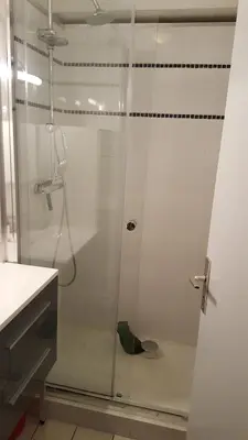 a shower with a glass door in a bathroom at Studio 4 personnes RDC avec jardin et parking sous terrain in Samoëns