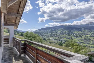a balcony with a view of the mountains at Chalet Carline in Combloux