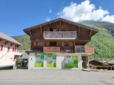 a large building with a balcony on top of it at Les Alpages - Newly Renovated - 2bed - Equipment Storage - Mont-Blanc Views in Les Houches