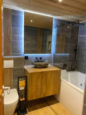 a bathroom with a sink and a toilet at 90m2 hypercentre, terrace, next to ski lift in Chamonix-Mont-Blanc