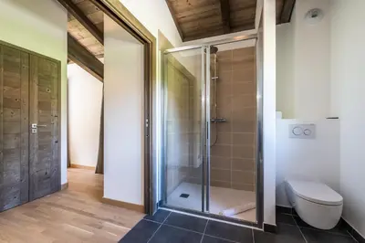 a bathroom with a shower and a toilet at Chalet Jatoba Chamonix - by EMERALD STAY in Chamonix-Mont-Blanc