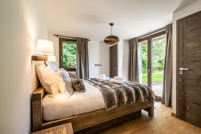 a bedroom with a bed and a window at Chalet Jatoba Chamonix - by EMERALD STAY in Chamonix-Mont-Blanc
