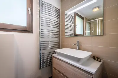 a bathroom with a sink and a mirror at Chalet Jatoba Chamonix - by EMERALD STAY in Chamonix-Mont-Blanc
