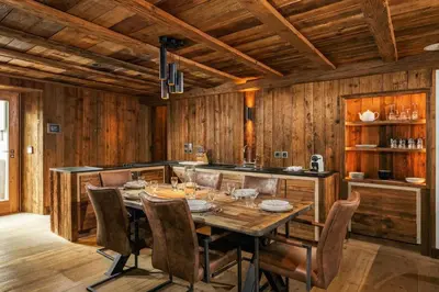 a dining room with a table and chairs at Maison du Roi - Happy Rentals in Chamonix-Mont-Blanc