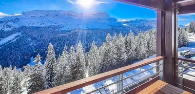a view from a window of snow covered trees at Exceptional 3 bed Penthouse with fireplace and stunning views in Flaine