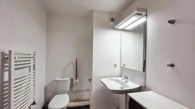 a bathroom with a toilet and a sink and a mirror at Résidence Les Pleiades - Appartement confortable · Centre station · Balcon · Parking couvert MAE-5454 in Flaine