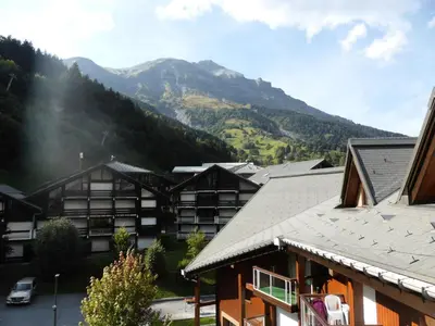 a view of a resort with mountains in the background at Résidence Combettes - Combettes D292 MAE-5624 in Les Contamines-Montjoie
