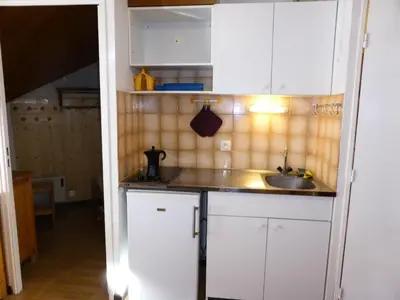 a kitchen with white cabinets and a sink at Résidence Combettes - Combettes D292 MAE-5624 in Les Contamines-Montjoie