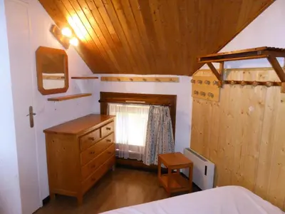 a bedroom with a bed and a wooden ceiling at Résidence Combettes - Combettes D292 MAE-5624 in Les Contamines-Montjoie