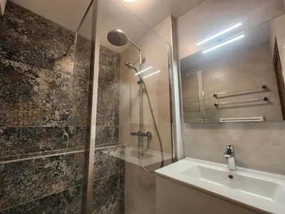 a bathroom with a sink and a shower at Studio coquet avec terrasse, calme et parking à Samoëns - FR-1-629-86 in Samoëns