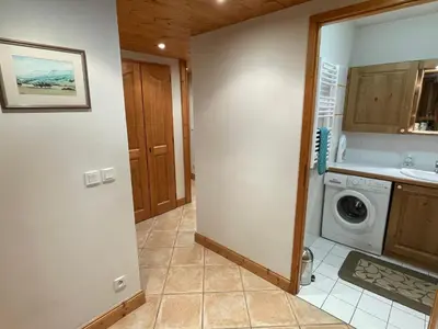 a bathroom with a washer and dryer in a kitchen at T3 calme à Samoëns avec Wifi et Parking - FR-1-629-45 in Samoëns