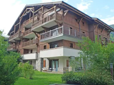 a large building with balconies on the side of it at T3 calme à Samoëns avec Wifi et Parking - FR-1-629-45 in Samoëns