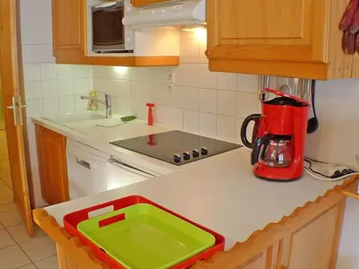 a kitchen with a green and red tray on a counter at Charmant T4 à Samoëns avec Balcon et Parking, 6 Pers. - FR-1-629-87 in Samoëns