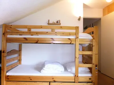 a bunk bed in a room with two bunk beds at Résidence L'enclave - Enclave J717 MAE-5744 in Les Contamines-Montjoie
