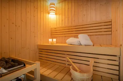 a sauna with two towels and a basket at Chalet Les Vosnes - OVO Network in Domancy