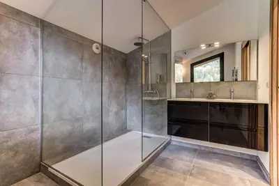 a bathroom with a shower and a sink at La Cordee 221 Penthouse - Chamonix All Year in Chamonix-Mont-Blanc