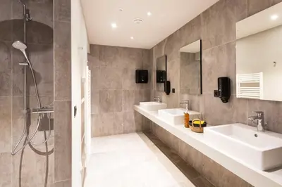 a bathroom with two sinks and a shower at La Cordee 221 Penthouse - Chamonix All Year in Chamonix-Mont-Blanc