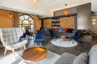 a living room with a couch and chairs at La Cordee 221 Penthouse - Chamonix All Year in Chamonix-Mont-Blanc