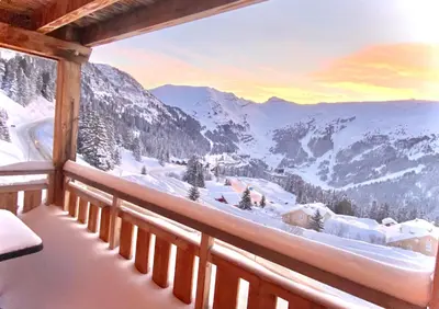 a room with a view of a snow covered mountain at Vue panoramique sur les montagnes plein Sud - T2 Skis aux pieds, Piscine & Spa in Flaine