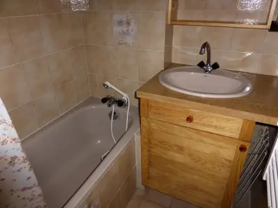a bathroom with a sink and a bath tub next to a sink at Résidence Les Loges - Loges 11 MAE-4364 in Saint-Gervais-les-Bains