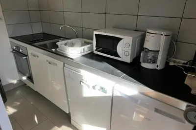 a kitchen with a microwave and a sink at Résidence Castel Des Roches C - Castel des Roches A27 MAE-4374 in Saint-Gervais-les-Bains