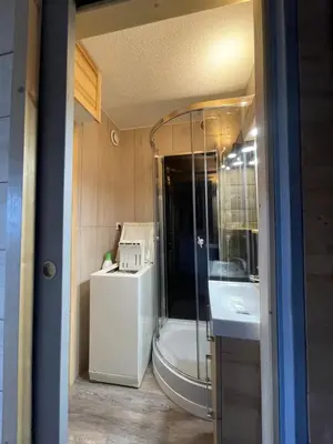 a bathroom with a tub and a shower and a sink at Samoëns 1600 les cimes in Samoëns