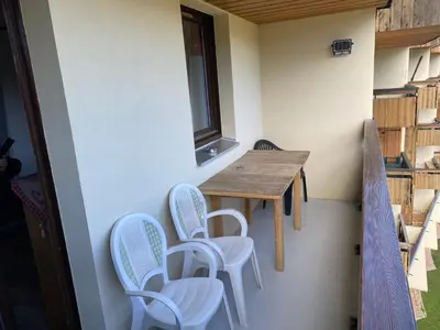 a small room with a table and chairs at Samoëns 1600 les cimes in Samoëns