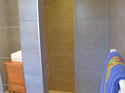 a bathroom with a shower with a glass door at Chalet Gentiane - un lieu idéal pour des vacances en famille ou entre amis - FR-1-629-88 in Samoëns