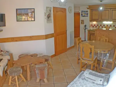 a kitchen and dining room with a table and chairs at Cosy, 3 pièces au centre, animaux admis, parking - FR-1-629-89 in Samoëns