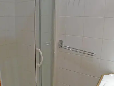 a shower with a glass door in a bathroom at Cosy, 3 pièces au centre, animaux admis, parking - FR-1-629-89 in Samoëns