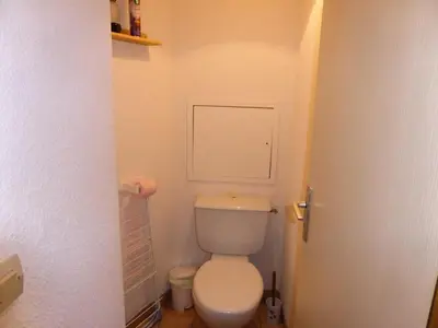 a bathroom with a toilet in a small room at Résidence Combettes - Les Combettes D258 MAE-0324 in Les Contamines-Montjoie