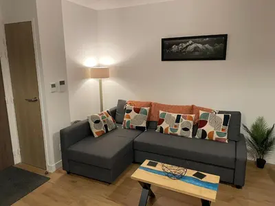 a living room with a couch and a table at Apartment Gallery Mont Blanc Saint-Gervais-Les-Bains in Saint-Gervais-les-Bains