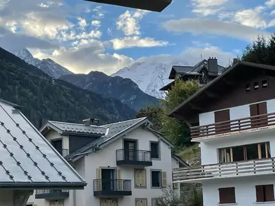 a group of buildings with mountains in the background at Apartment Gallery Mont Blanc Saint-Gervais-Les-Bains in Saint-Gervais-les-Bains