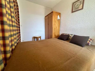 a bedroom with a large bed in a room at Appartement skis aux pieds à Samoëns 1600 - FR-1-624-79 in Samoëns