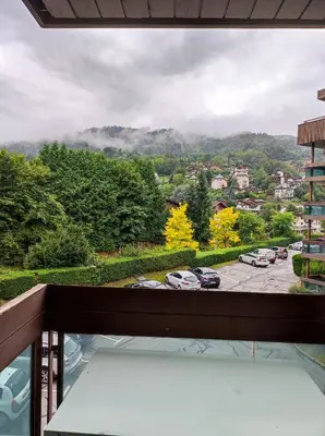 a balcony with a view of a parking lot at Appartement proche village et remontées mécaniques in Saint-Gervais-les-Bains