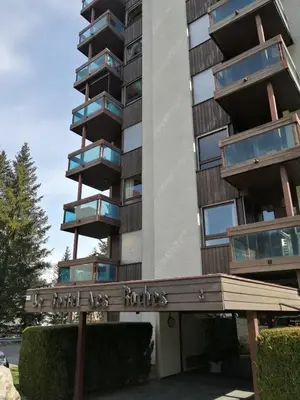 a building with a sign in front of it at Appartement proche village et remontées mécaniques in Saint-Gervais-les-Bains