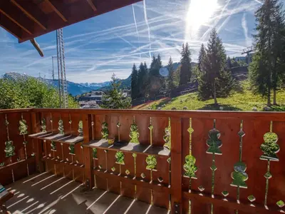 a large wooden building with a road in front of it at Duplex 10 pers. au pied des pistes à Morillon - FR-1-642-2 in Morillon