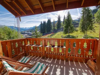 a balcony with chairs and a view of a mountain at Duplex 10 pers. au pied des pistes à Morillon - FR-1-642-2 in Morillon
