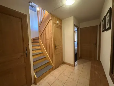 a kitchen with wooden cabinets and a white refrigerator at Appartement spacieux 4 chambres, pieds pistes, parking inclus - FR-1-642-4 in Morillon