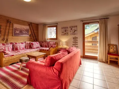a living room with two couches and a table at Appartement spacieux 4 chambres, pieds pistes, parking inclus - FR-1-642-4 in Morillon
