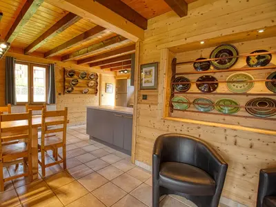 a kitchen and dining room in a log cabin at Chalet au pied des pistes, sauna et terrasse, pour 12 pers. - FR-1-642-5 in Morillon