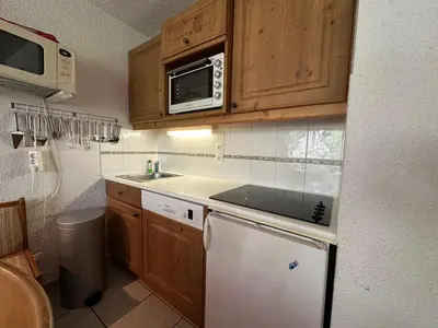 a small kitchen with a sink and a microwave at Appartement confortable pour 6 pers. avec balcon à Morillon - FR-1-642-11 in Morillon