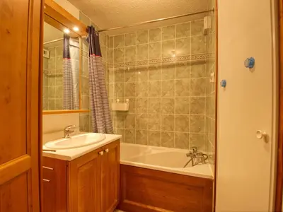 a bathroom with a sink and a bath tub at Appartement confortable pour 6 pers. avec balcon à Morillon - FR-1-642-11 in Morillon