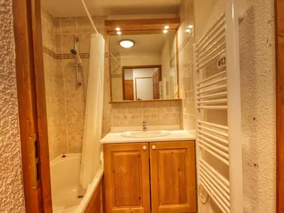 a bathroom with a sink and a shower and a tub at Appartement confortable 6 pers, proche jardin d'enfants - FR-1-642-15 in Morillon
