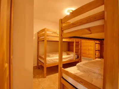 a bedroom with two bunk beds in a room at Appartement 2 ch - 6 pers - Pieds des pistes à Morillon - FR-1-642-21 in Morillon