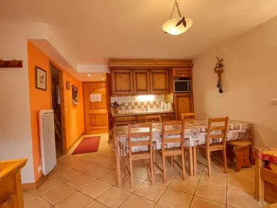 a kitchen and dining room with a table and chairs at Appartement 7 pers, proche des pistes, balcon - FR-1-642-40 in Morillon